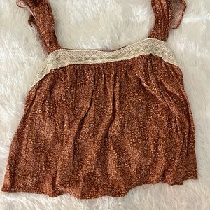 Burnt orange tank with white tribal design